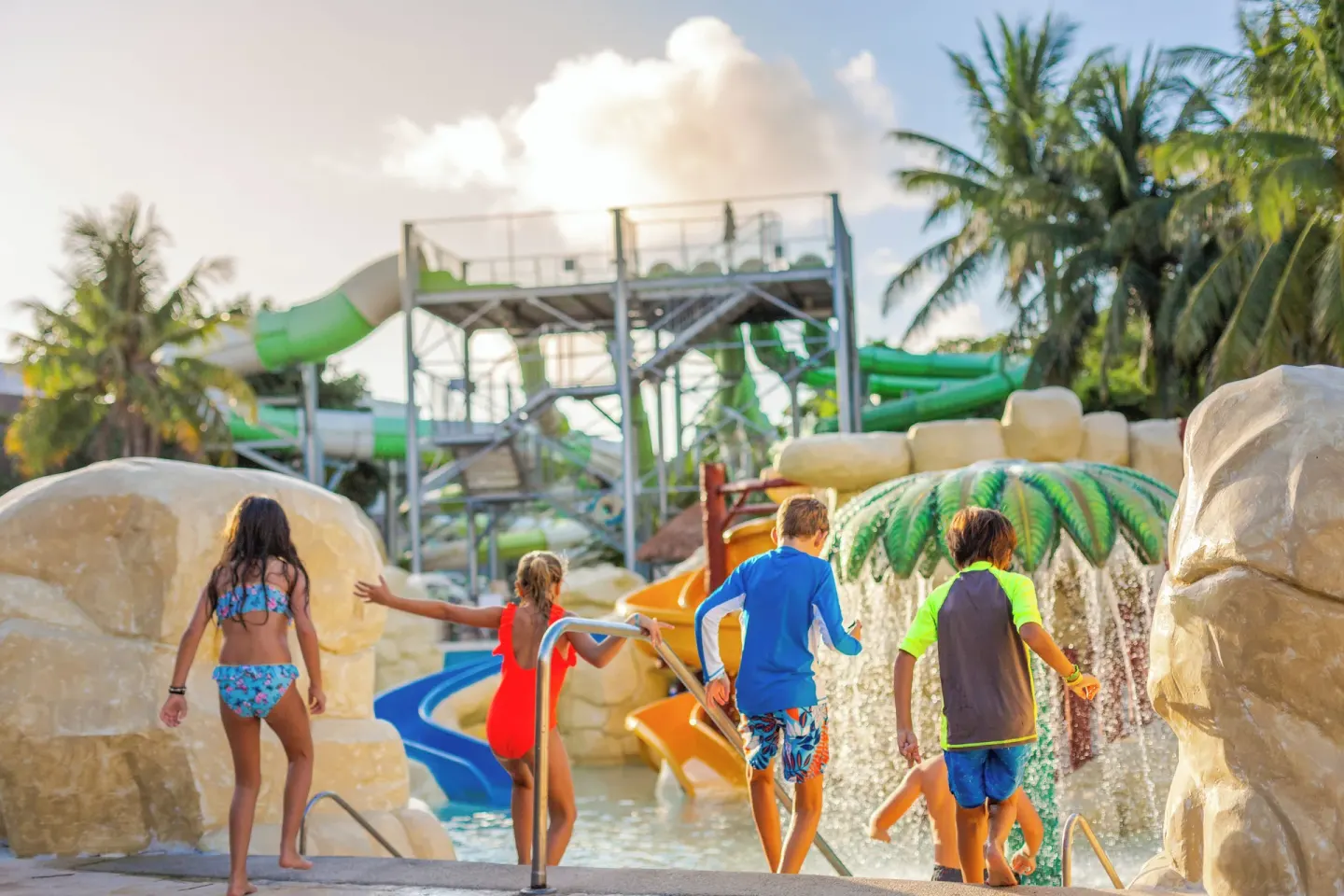 Children enter the water park pool at Sandos Caracol Nature Resort & Water Park.