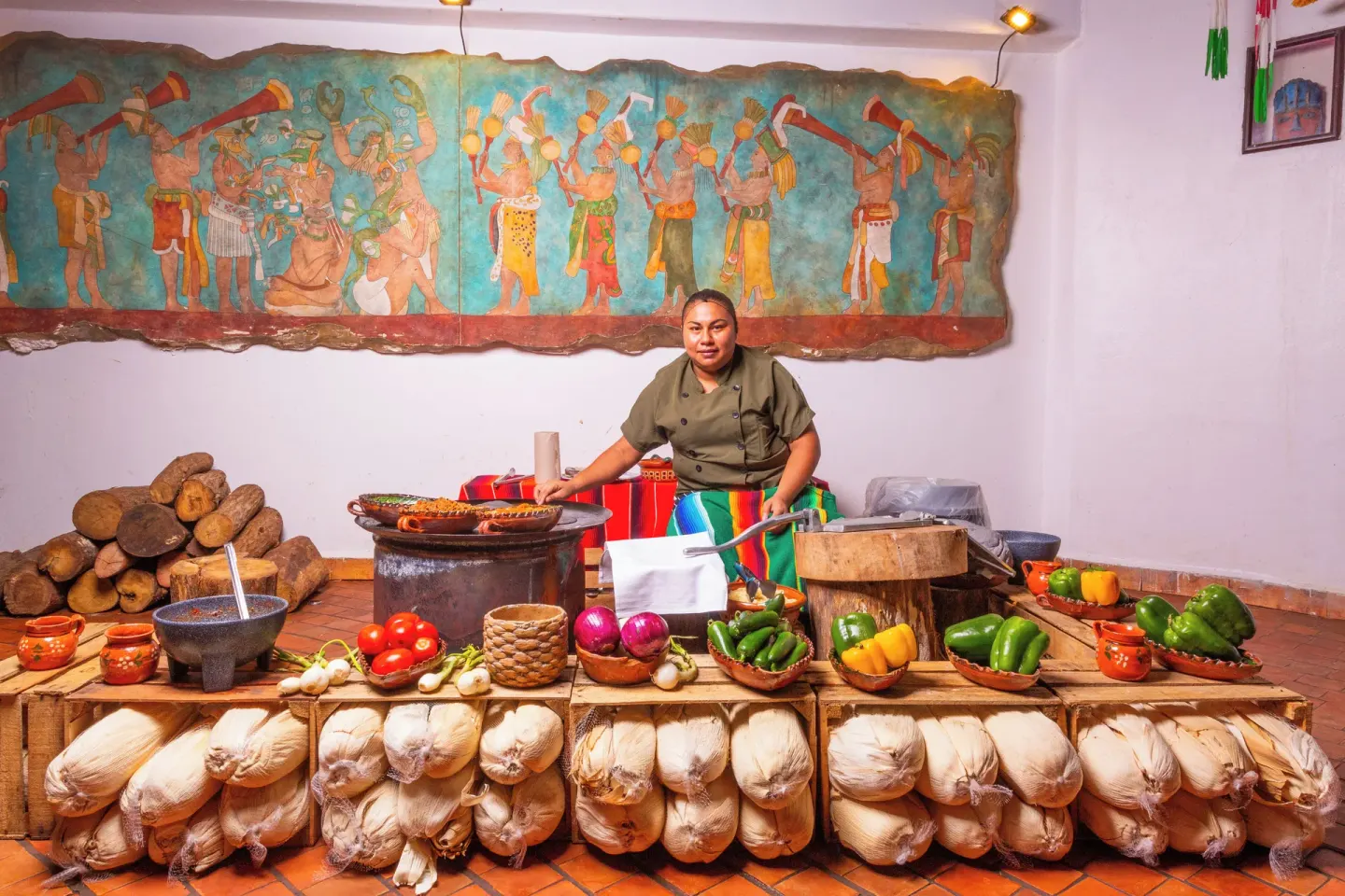 Cook with corn, vegetables, and clay pots at Sandos Caracol Nature Resort & Water Park.
