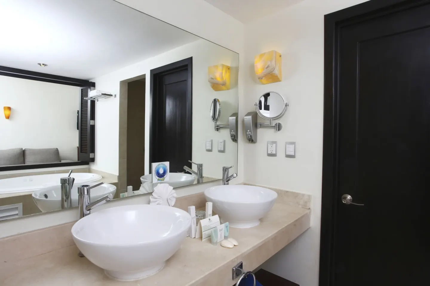 Double vanity in a Deluxe Select room bathroom at Sandos Caracol Nature Resort & Water Park.