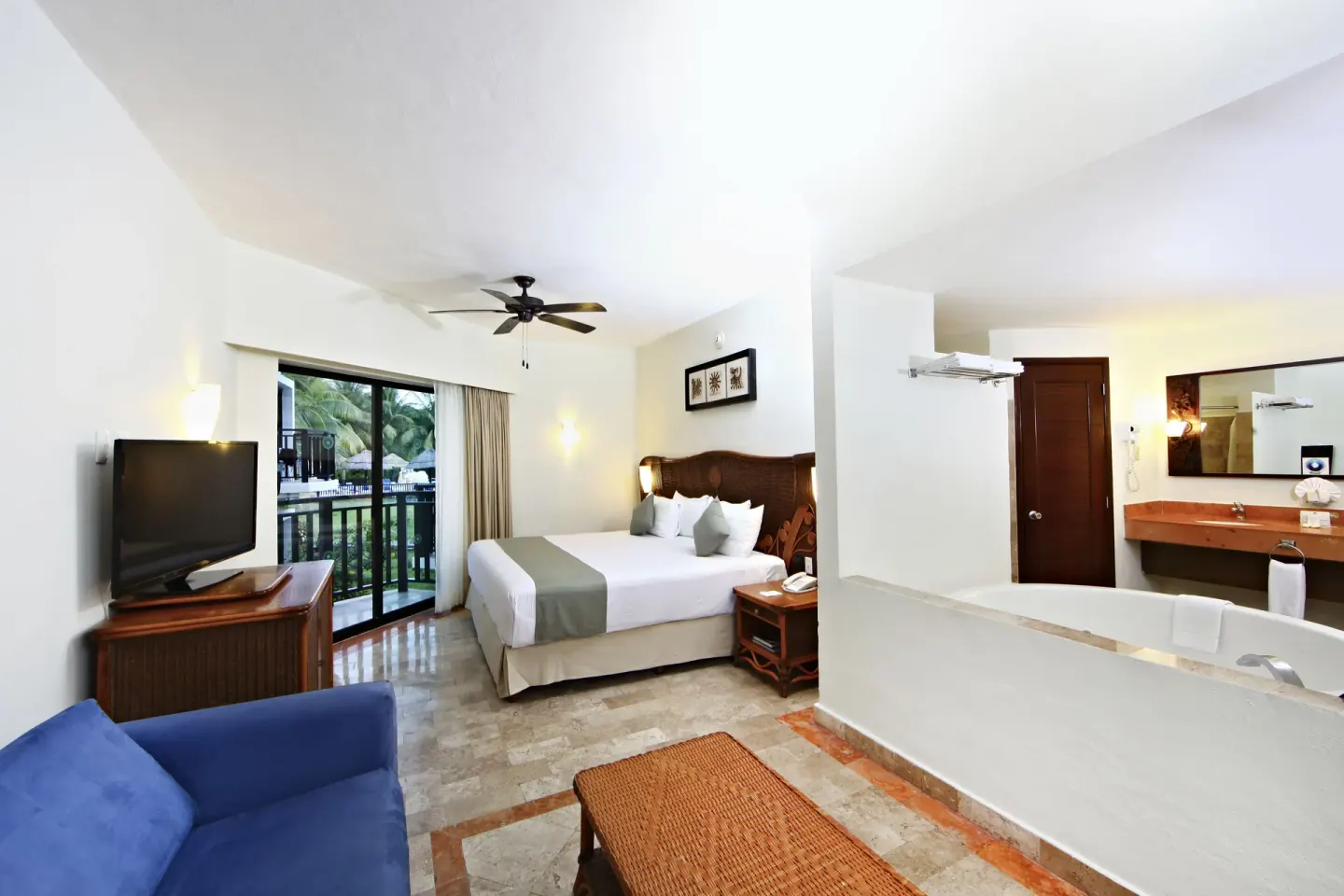 Deluxe Select adults-only room with king bed and open bath at Sandos Caracol Nature Resort & Water Park.