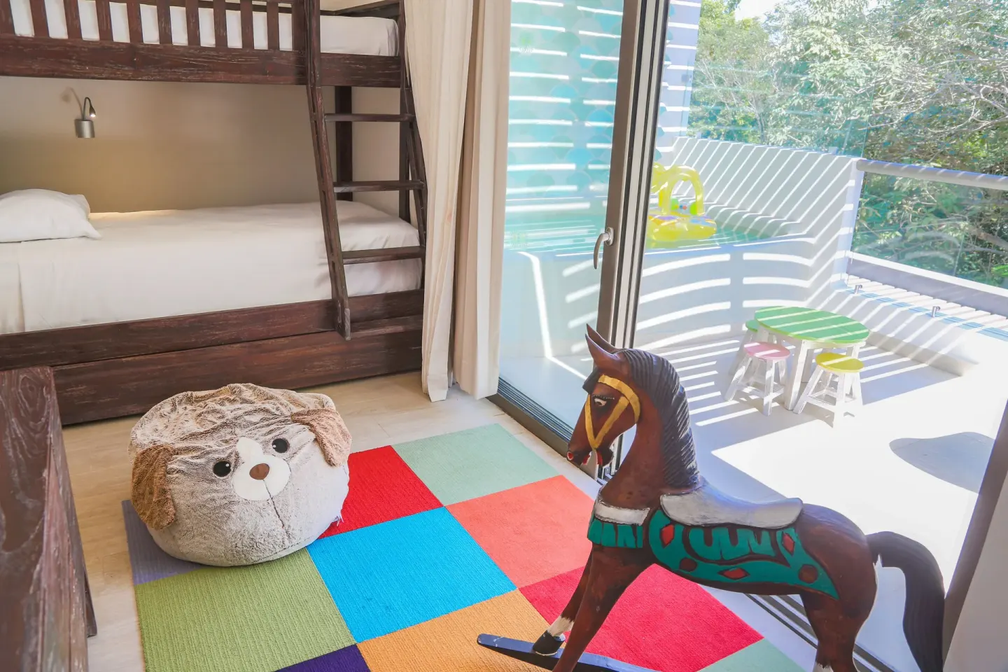 Eco Junior Suite bunk room and balcony at Sandos Caracol Nature Resort & Water Park.
