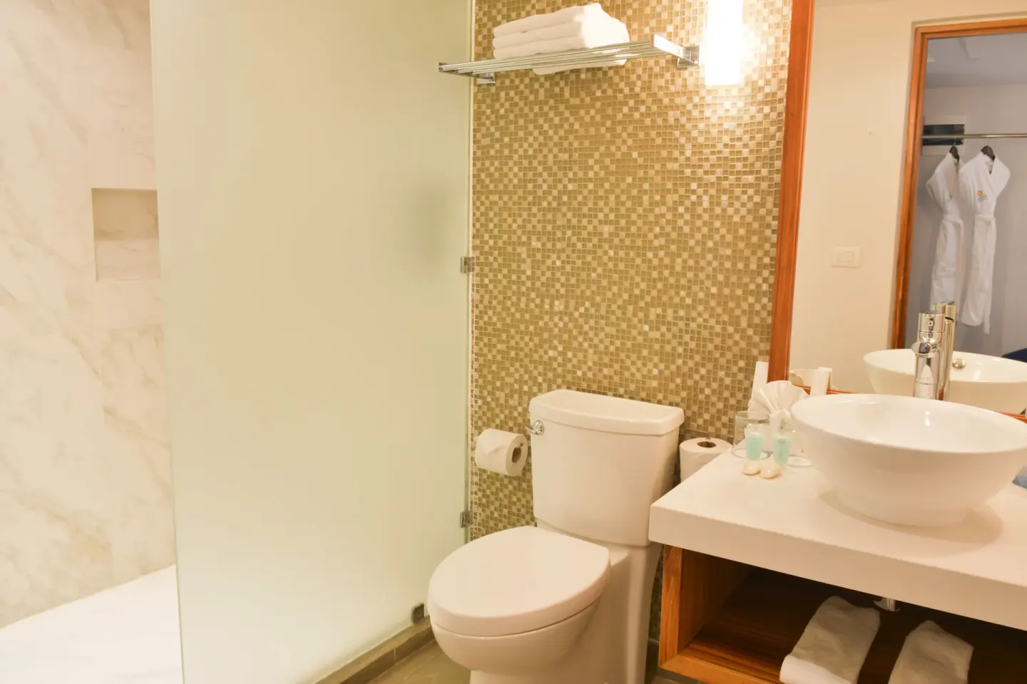 Eco Family Superior bathroom with shower and vanity at Sandos Caracol Nature Resort & Water Park.