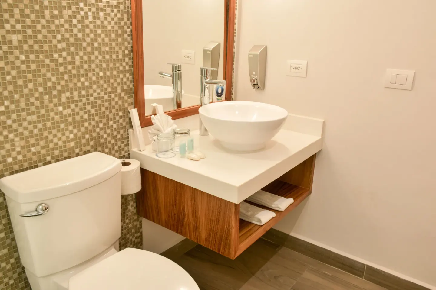 Eco Family Superior bathroom vanity and toilet at Sandos Caracol Nature Resort & Water Park.