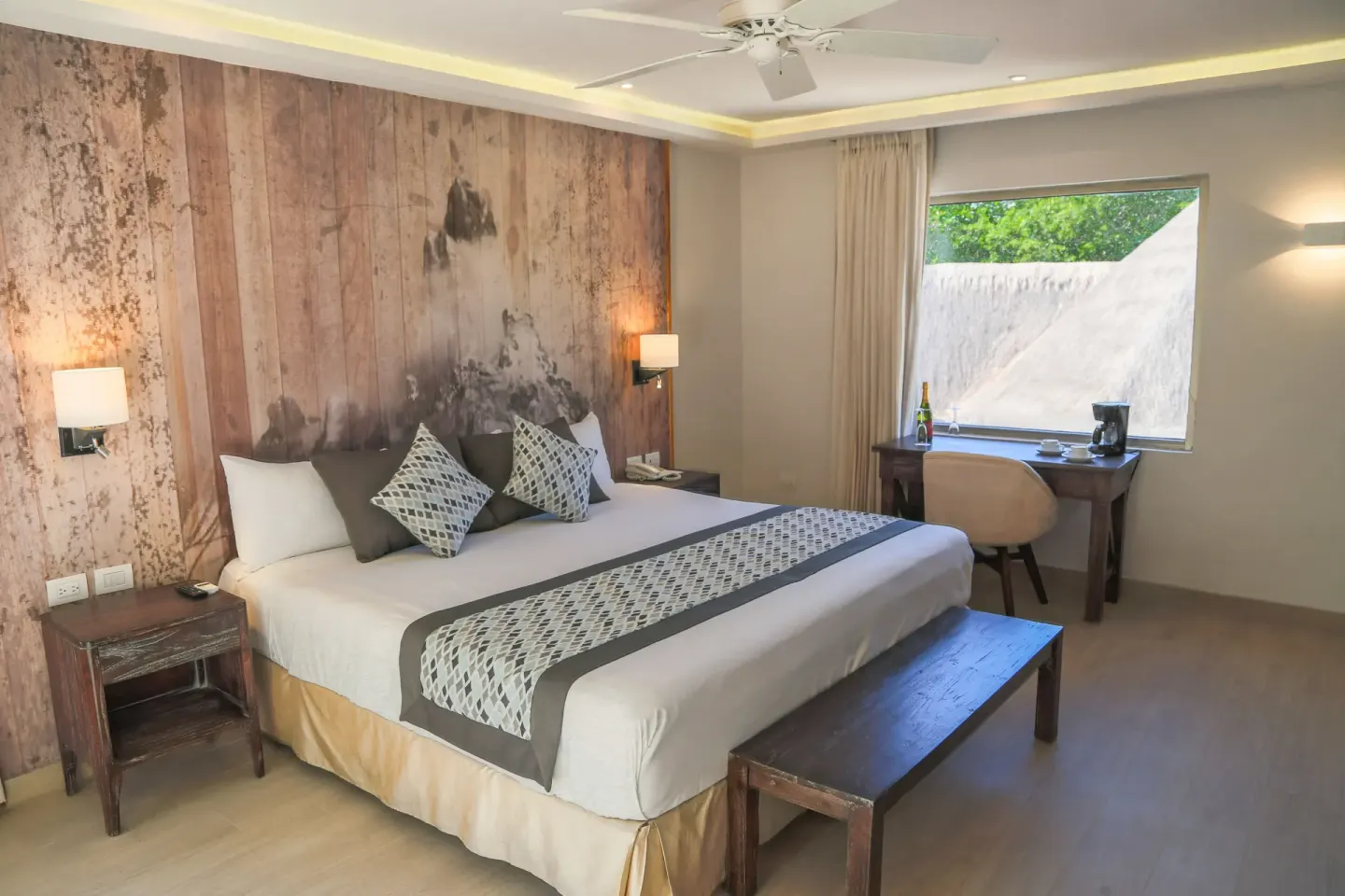 Eco Family Superior king bed and desk at Sandos Caracol Nature Resort & Water Park.