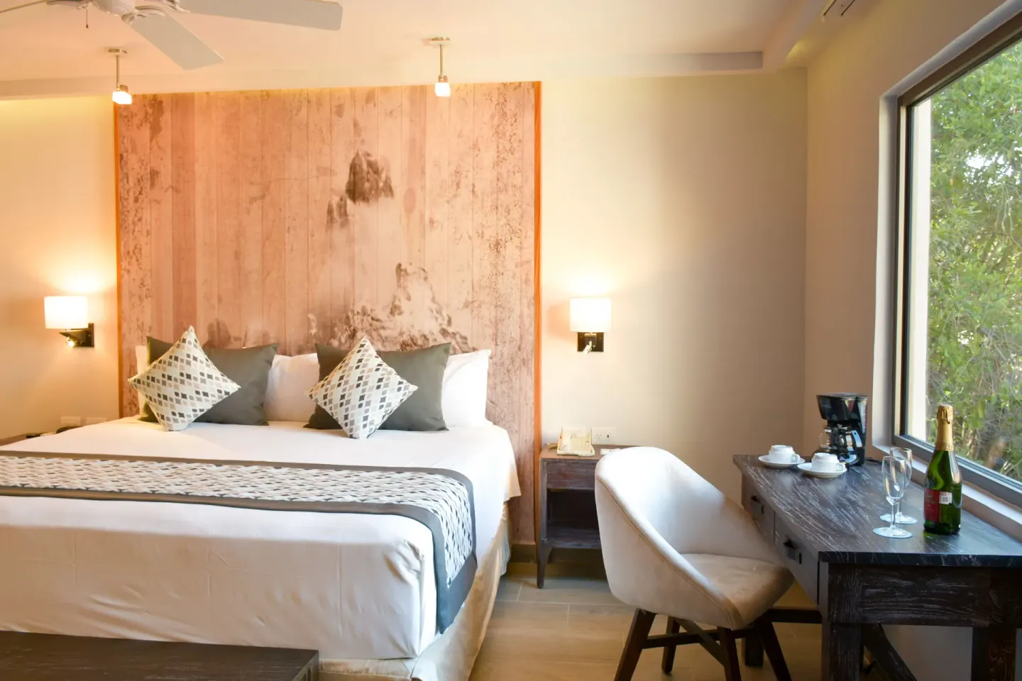 Eco Family Superior king bed and window desk at Sandos Caracol Nature Resort & Water Park.