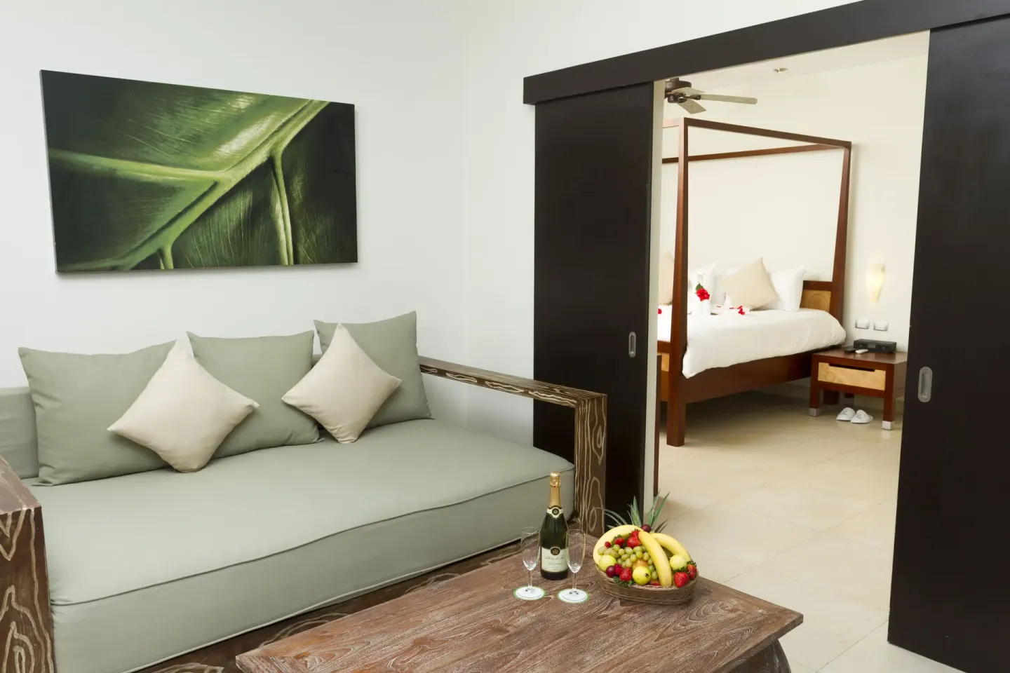 Pool View Penthouse sitting area and bedroom doorway at Sandos Caracol Nature Resort & Water Park.