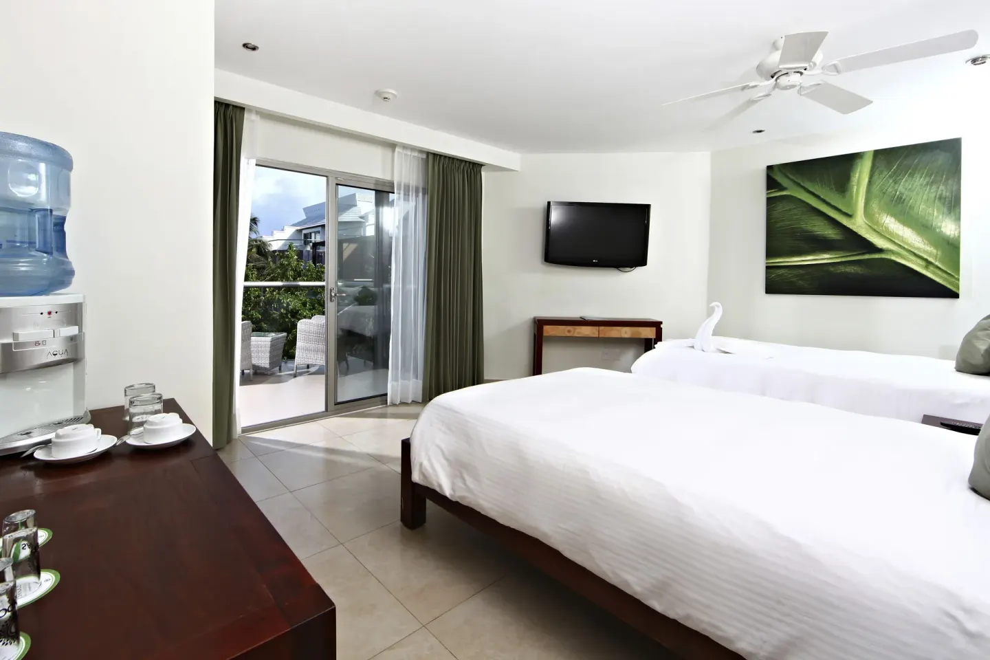 Pool View Superior room with two beds and balcony doors at Sandos Caracol Nature Resort & Water Park.