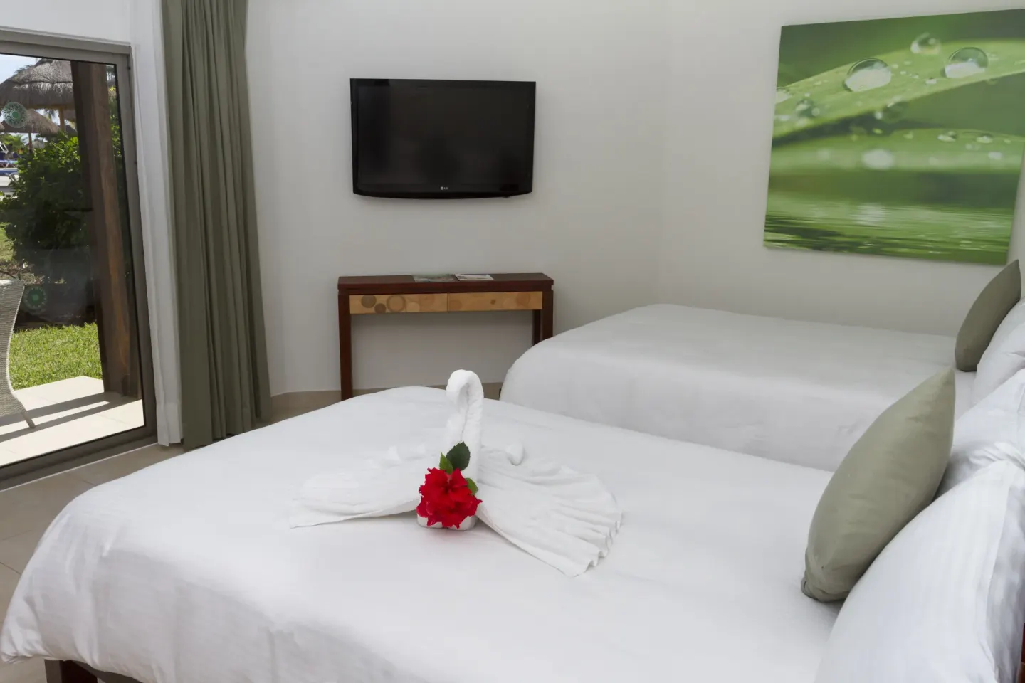 Pool View Superior room with two beds and garden door at Sandos Caracol Nature Resort & Water Park.