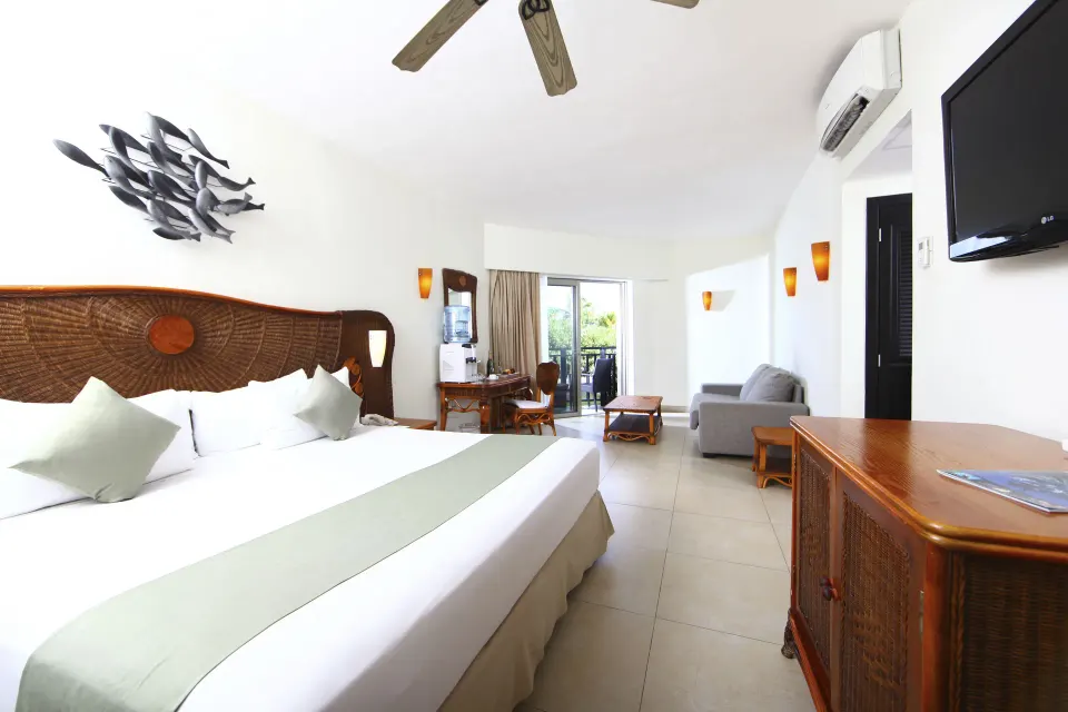 Superior Select king room with balcony at Sandos Caracol Nature Resort & Water Park