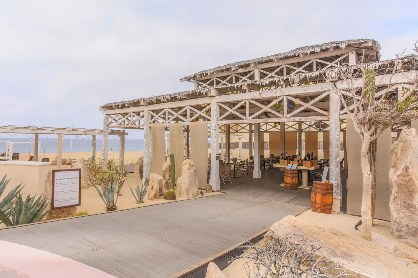 Open-air beach club structure with thatched roof at Sandos Finisterra.