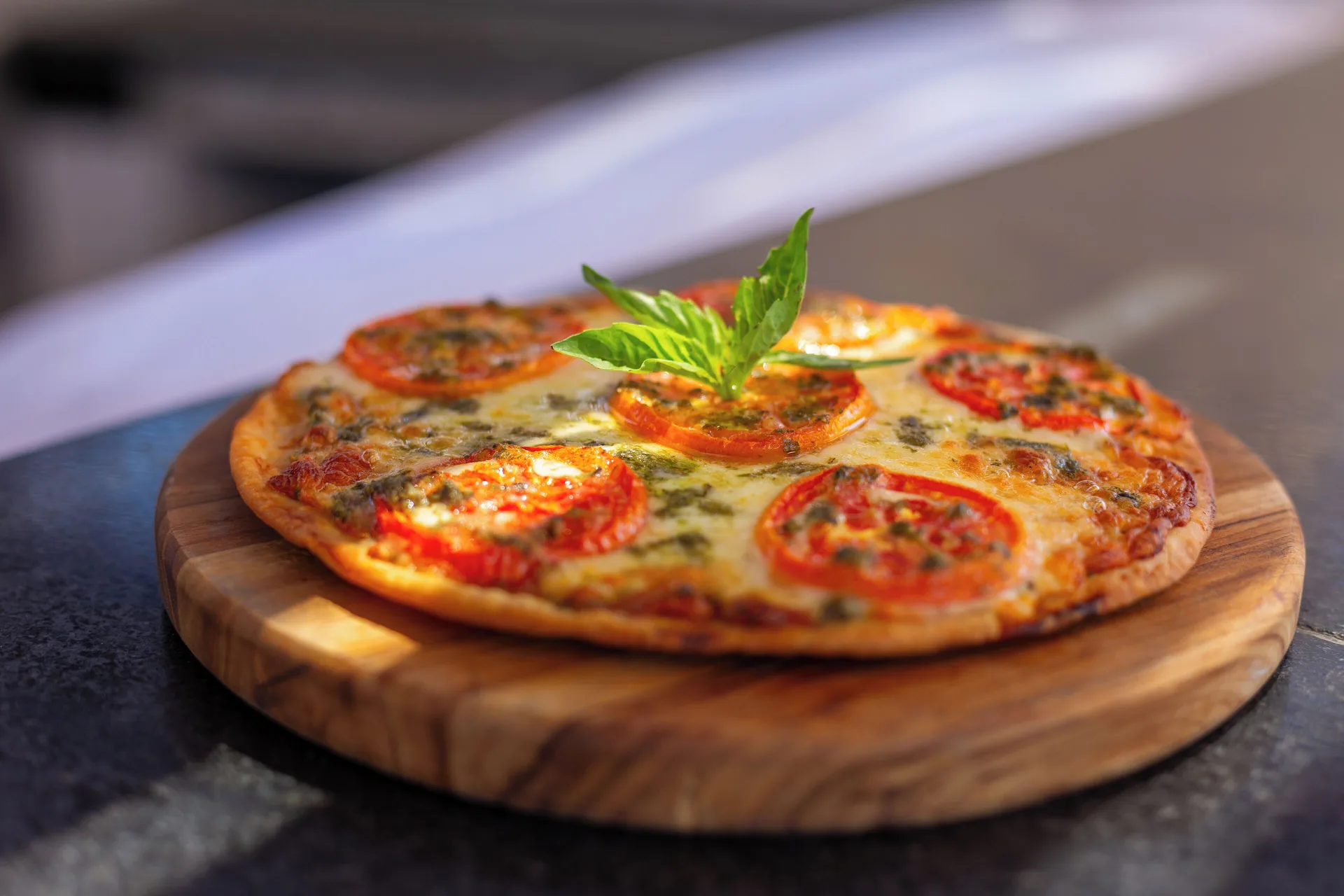 Tomato and basil pizza on a wooden board at Sandos Finisterra.