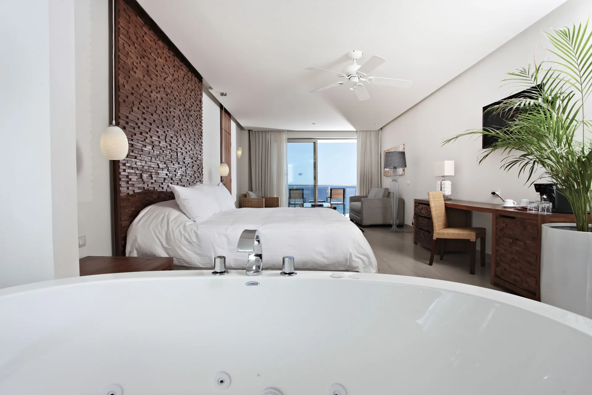 Finisterra Suite with king bed and soaking tub at Sandos Finisterra.