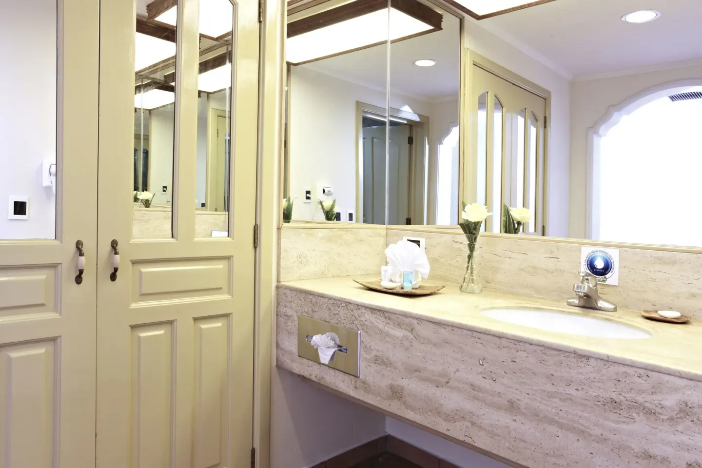 Junior Suite Garden View bathroom vanity with mirror and sink at Sandos Finisterra.