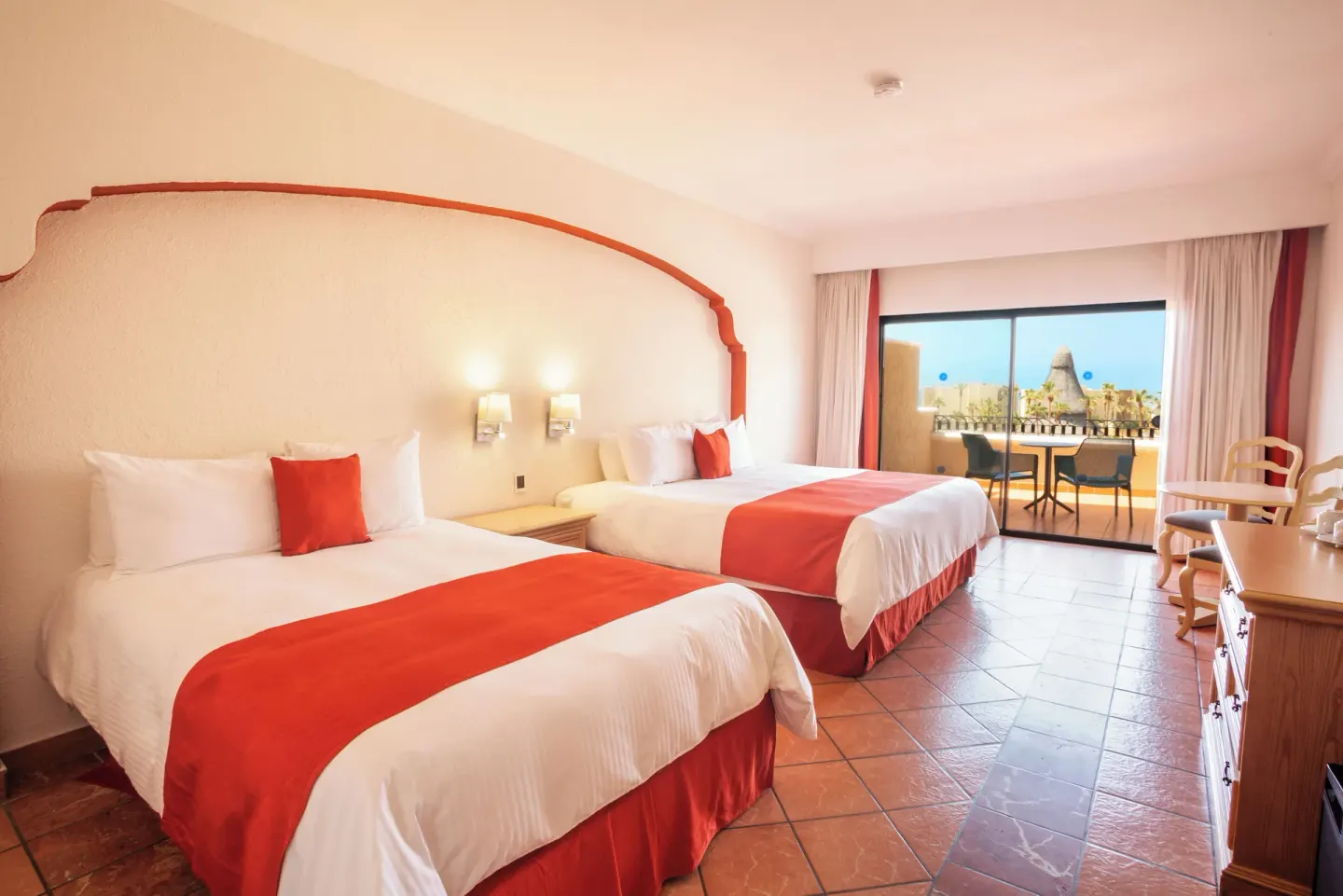 Junior Suite Garden View with two beds and a furnished balcony at Sandos Finisterra.
