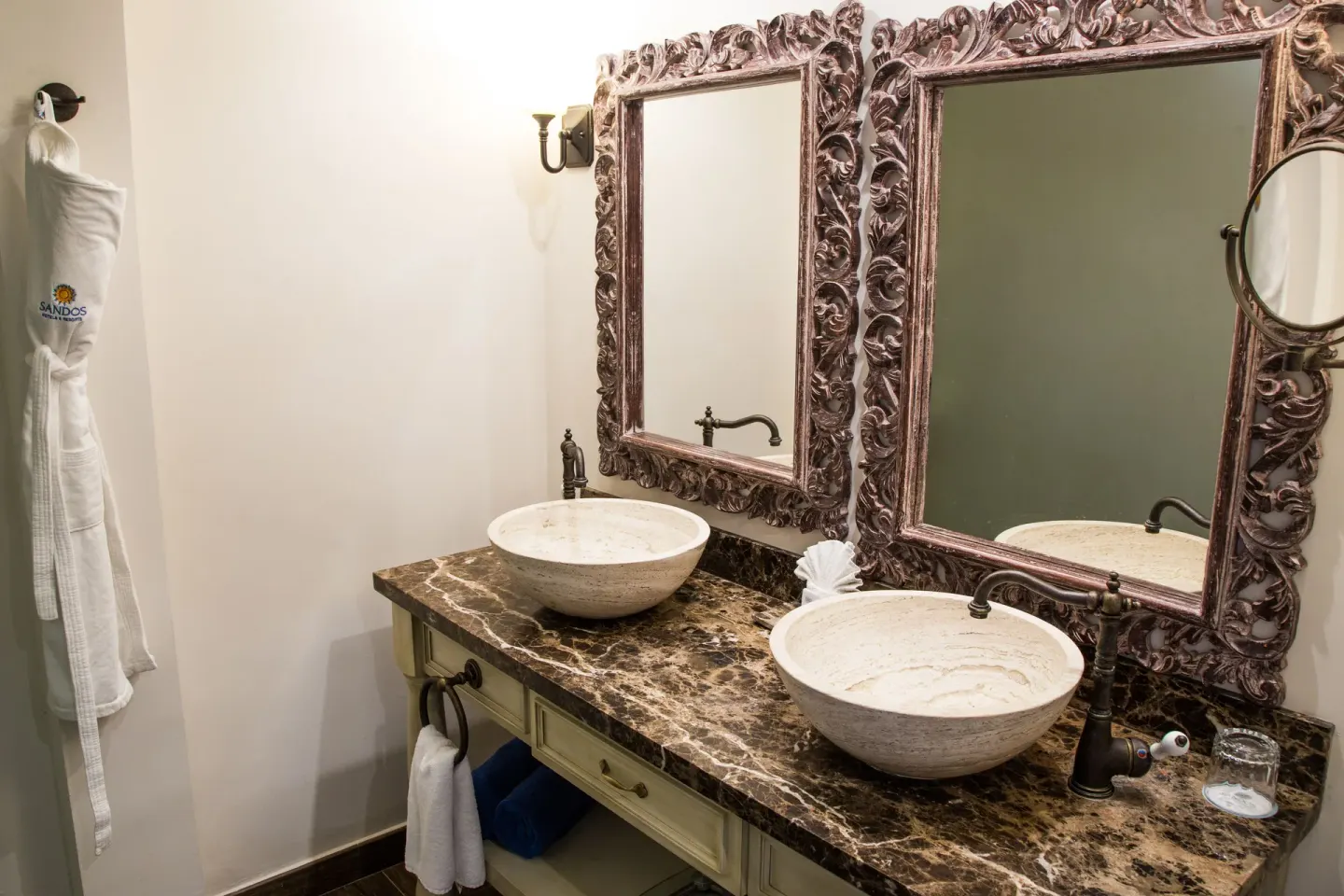 Marina Bay View bathroom with double vessel sinks at Sandos Finisterra.
