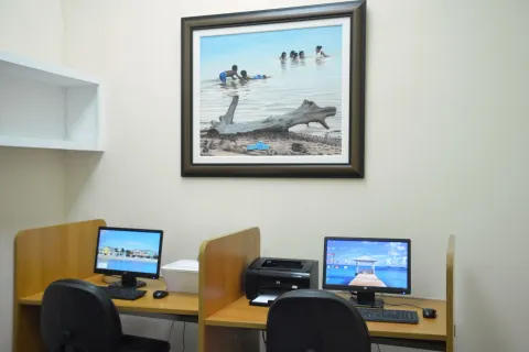 Computer workstations and printer in a business area at Sandyport Beach Resort.