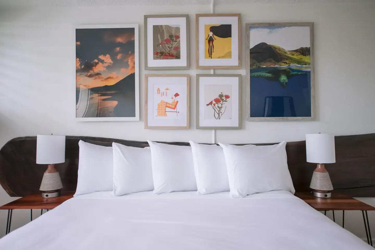 Bay View guest room king bed with white pillows and framed artwork at SCP Hilo Hotel.