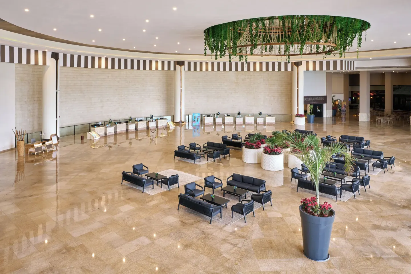 Large lobby lounge and reception desks at Seadust Cancún Family Resort.