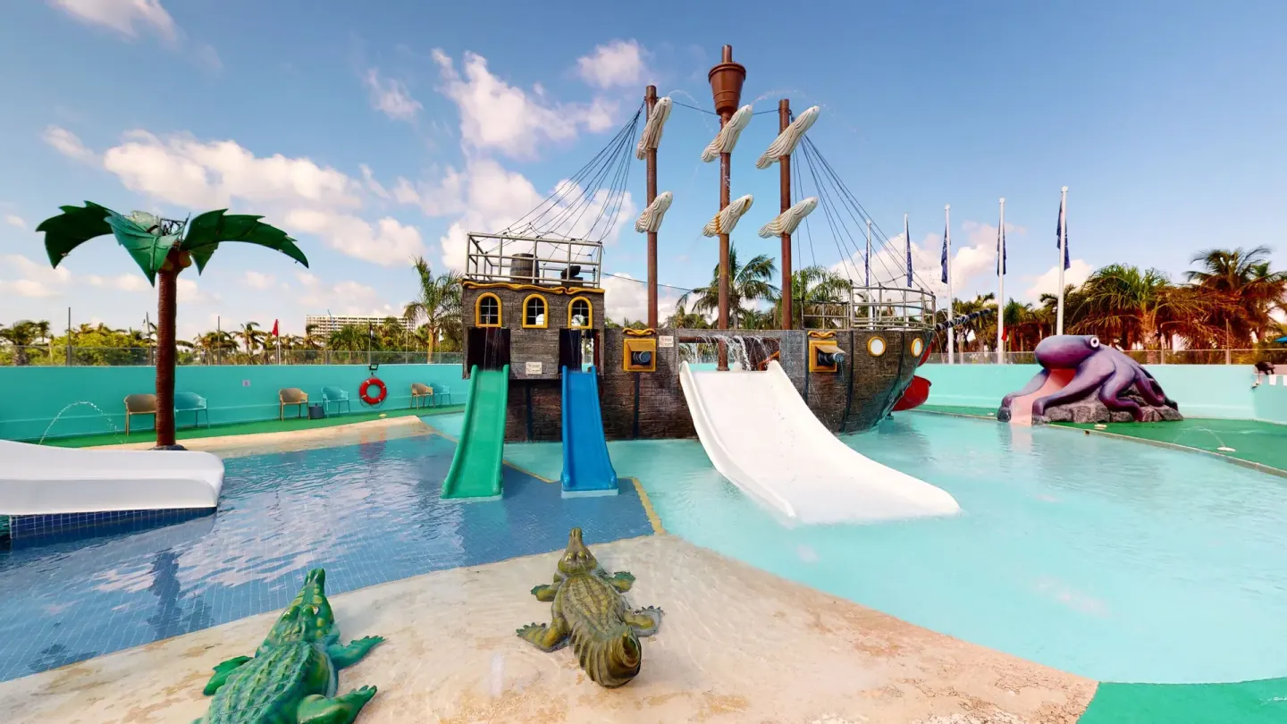 Pirate ship pool play area with animal figures at Seadust Cancún Family Resort.