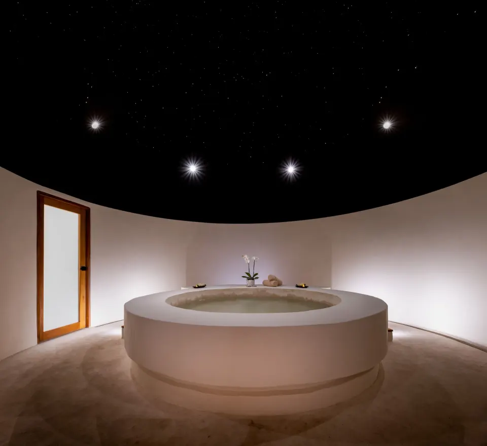 Round spa tub beneath a starry ceiling at Seadust Cancún Family Resort.