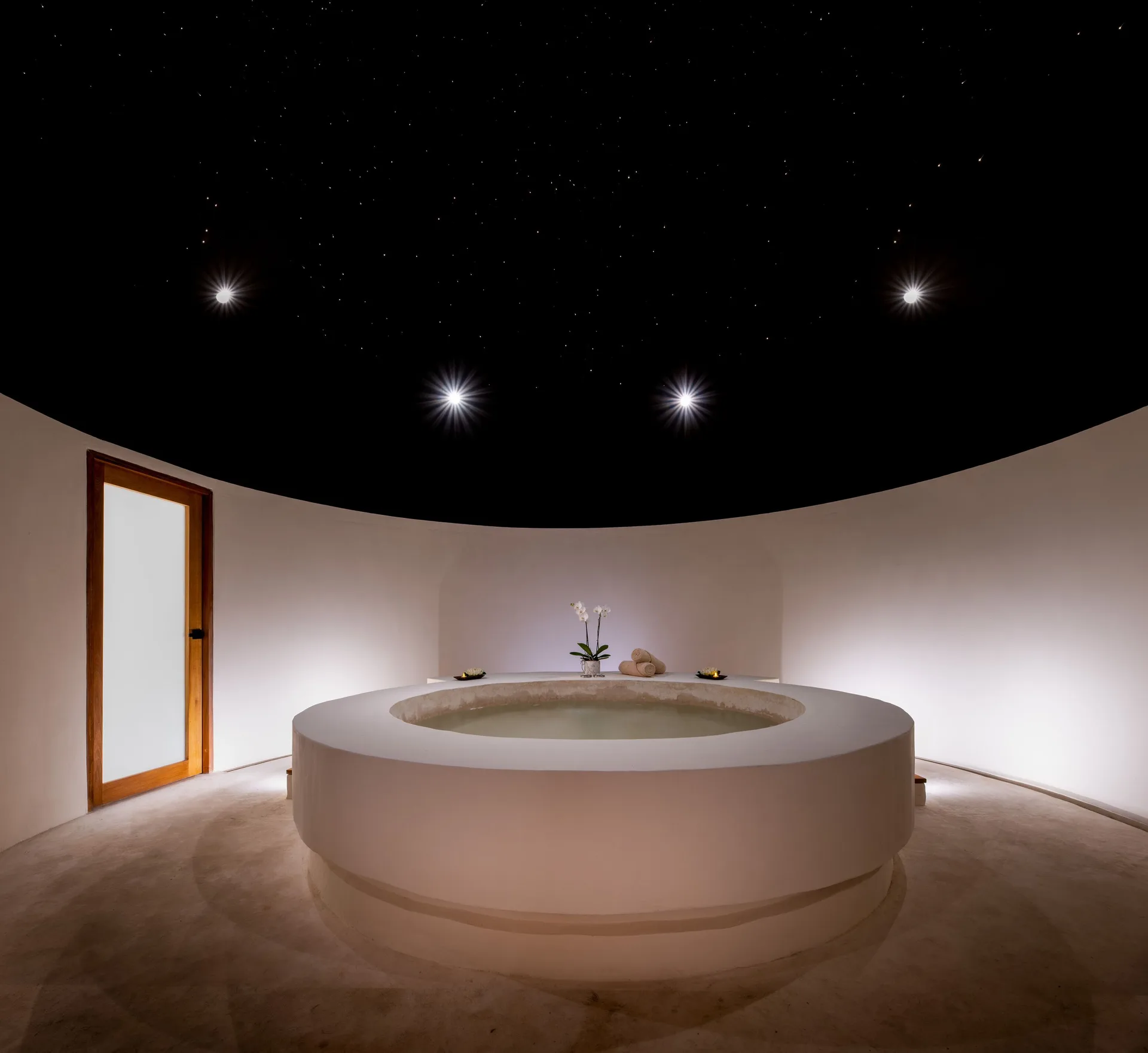 Round spa tub beneath a starry ceiling at Seadust Cancún Family Resort.