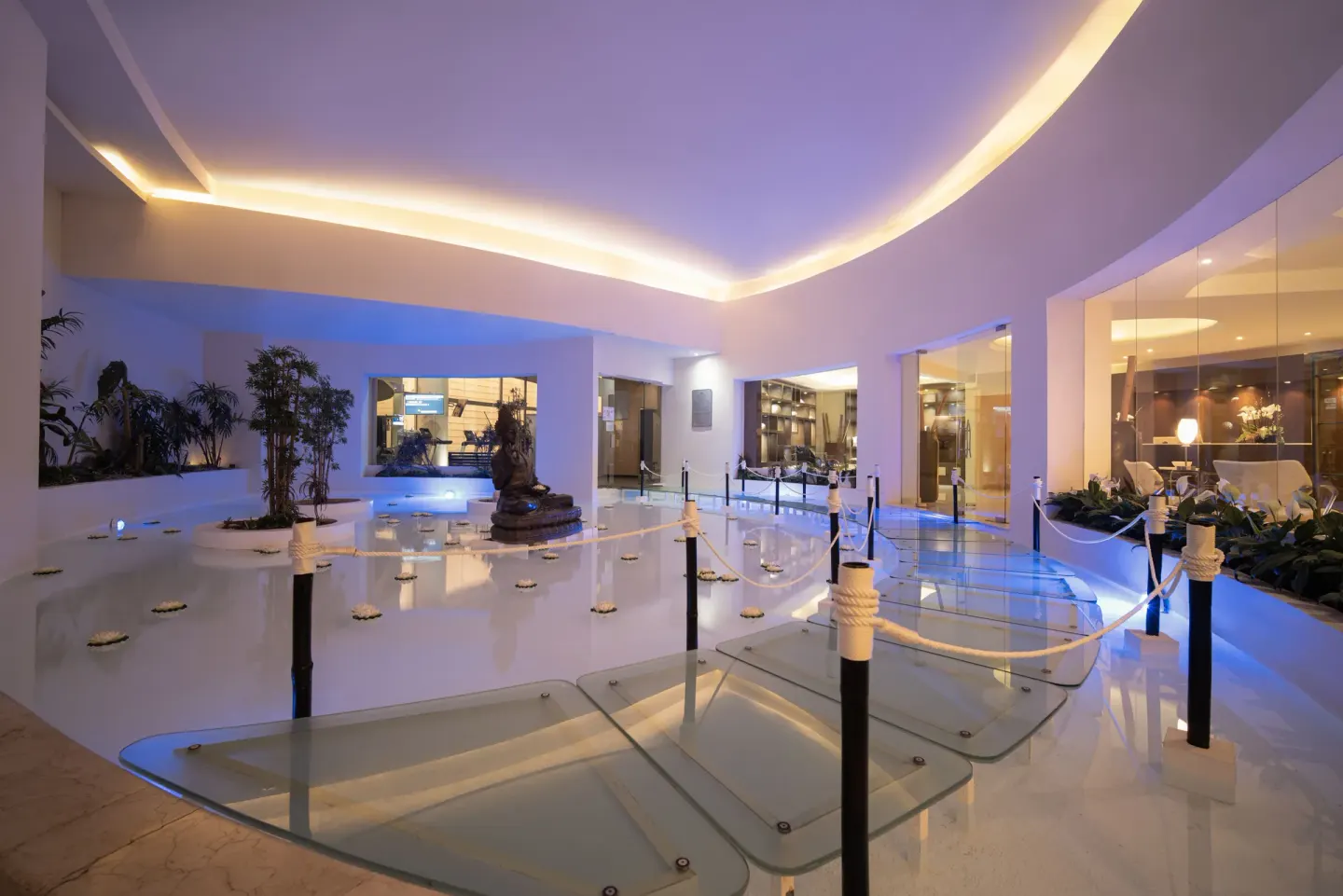 Spa water feature and glass walkways at Seadust Cancún Family Resort.