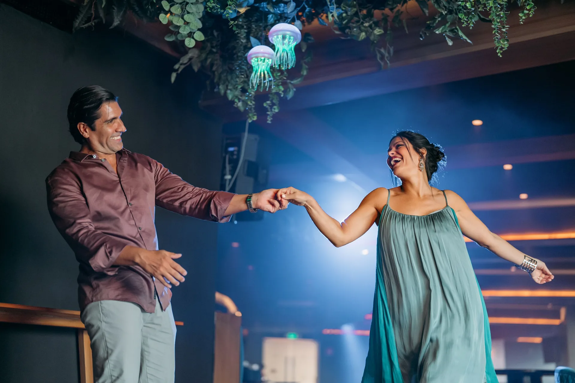 Couple dancing in a lounge at Seadust Cancún Family Resort.