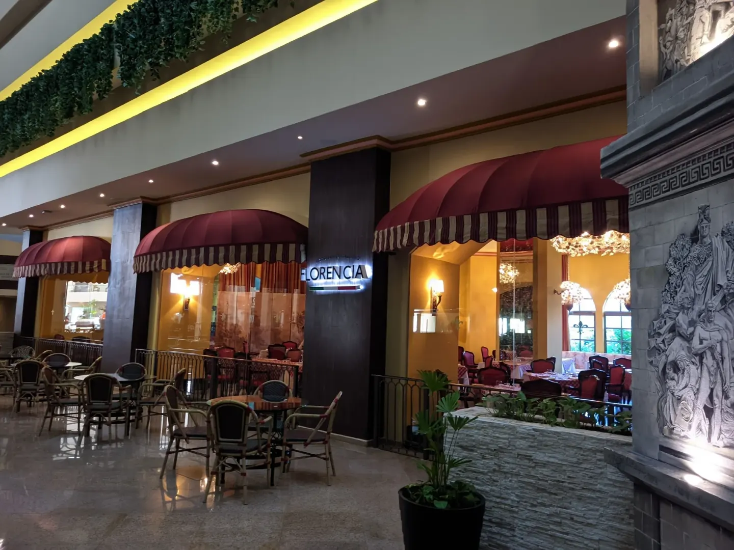 Florencia restaurant entrance with red awnings at Seadust Cancún Family Resort.