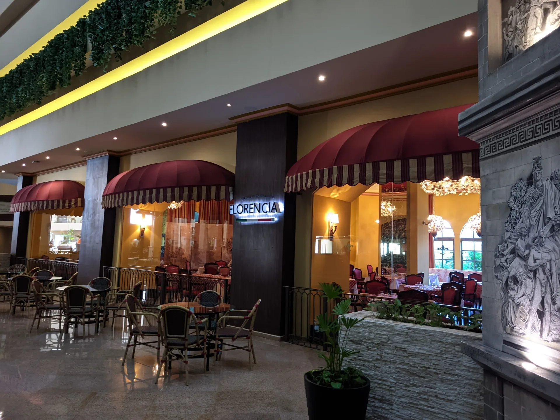 Florencia restaurant entrance with red awnings at Seadust Cancún Family Resort.