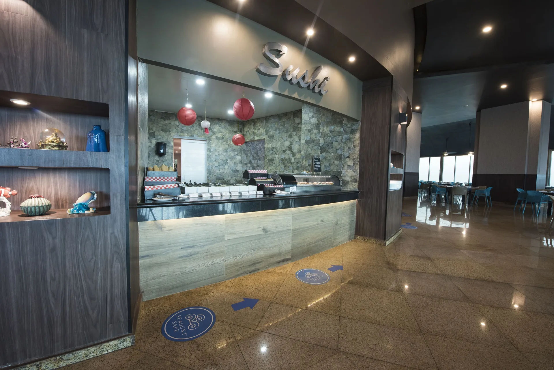 Sushi counter with red lanterns at Seadust Cancún Family Resort.