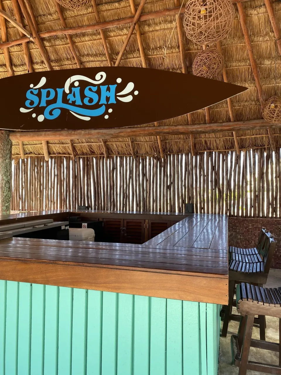 Splash bar sign over a thatched counter at Seadust Cancún Family Resort.