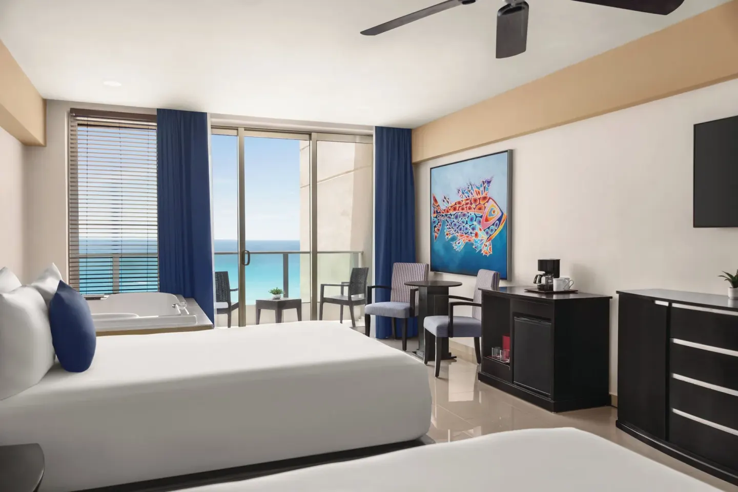 Premier Suite with two beds, balcony and ocean view at Seadust Cancún Family Resort.