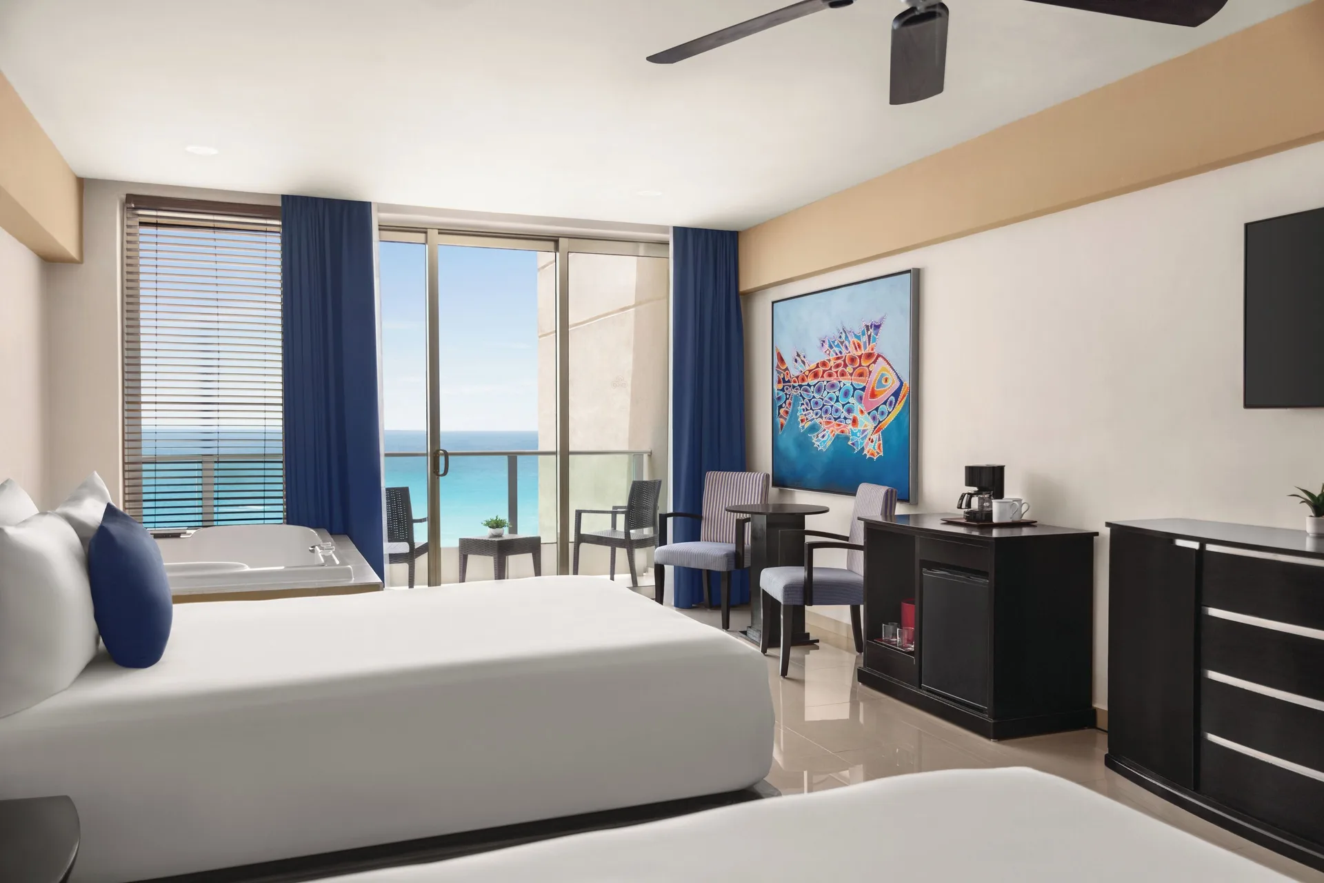 Premier Suite with two beds, balcony and ocean view at Seadust Cancún Family Resort.