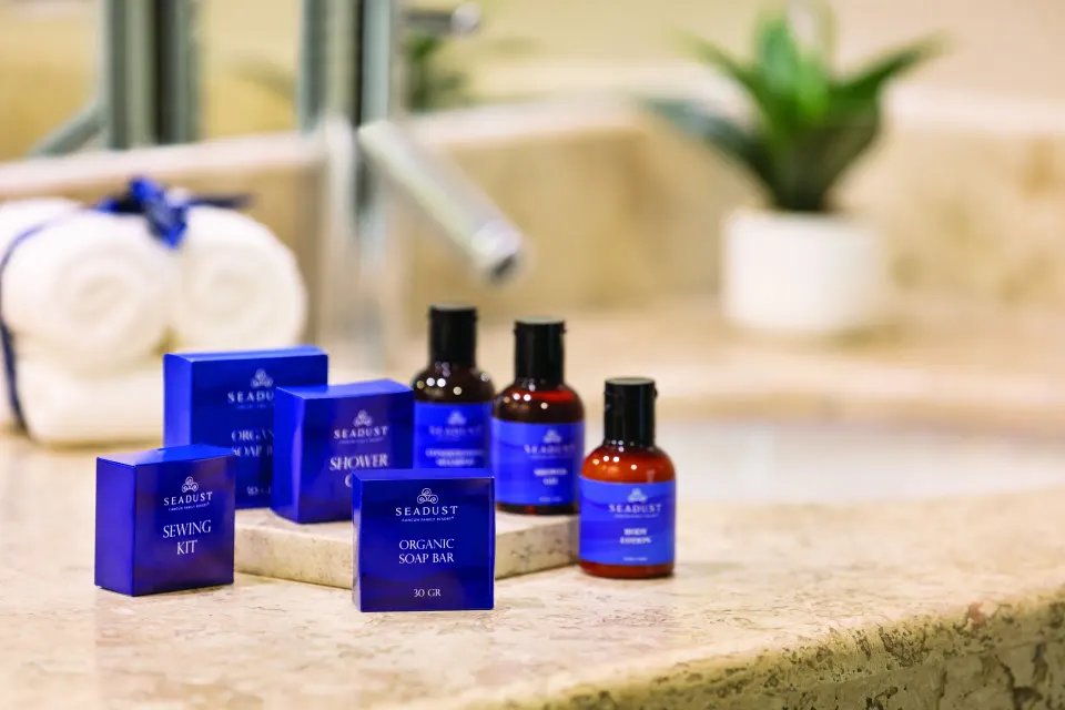 Standard Suite bathroom amenities on a marble counter at Seadust Cancún Family Resort.