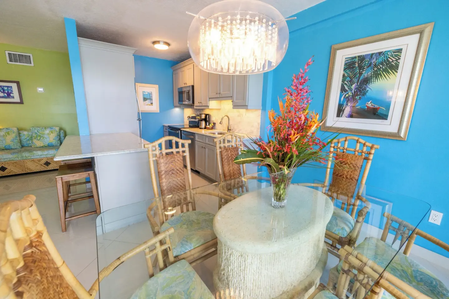Dining area and kitchen with blue accent wall at Secret Harbour Beach Resort.