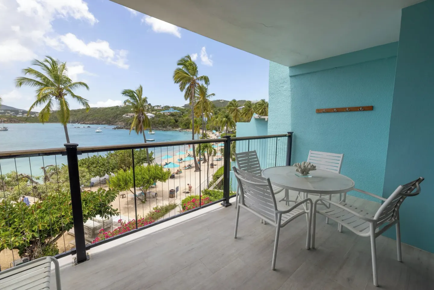Furnished balcony overlooking the beach and bay at Secret Harbour Beach Resort.
