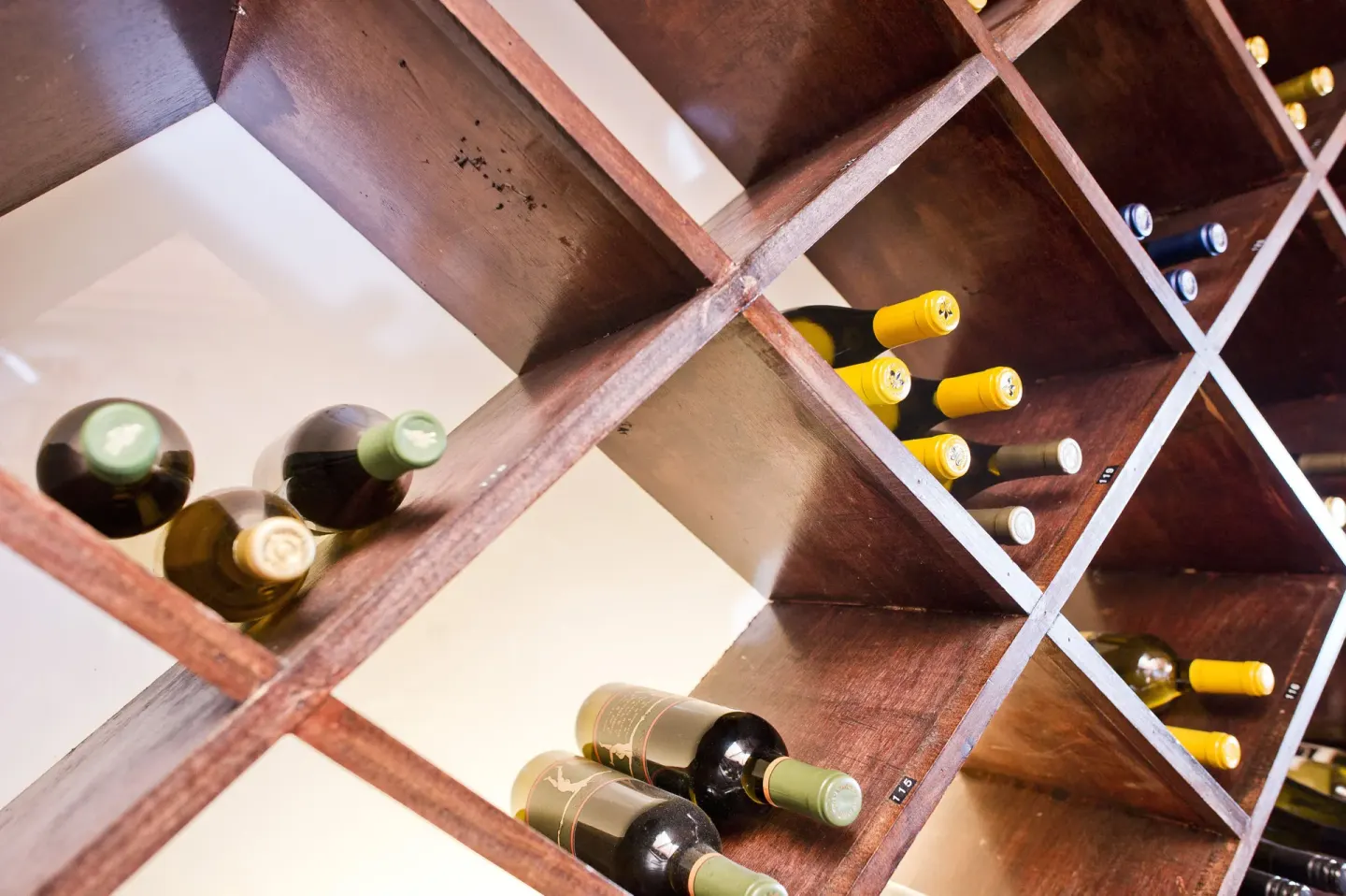 Wine bottles stored in wooden cubbies at Secret Harbour Beach Resort.
