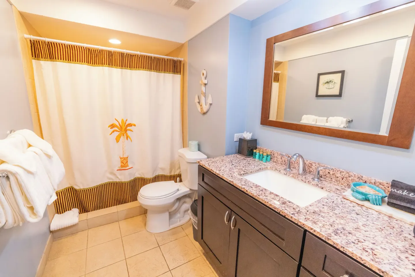 Beachfront condo bathroom with vanity and tub-shower at Secret Harbour Beach Resort.