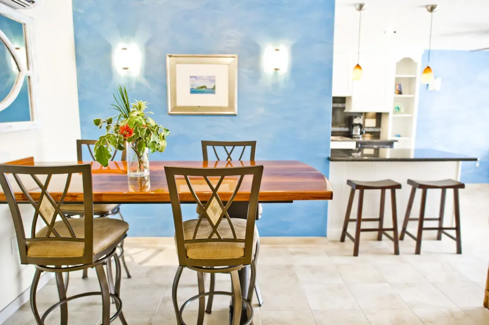 Beachfront condo dining table and kitchen bar at Secret Harbour Beach Resort.