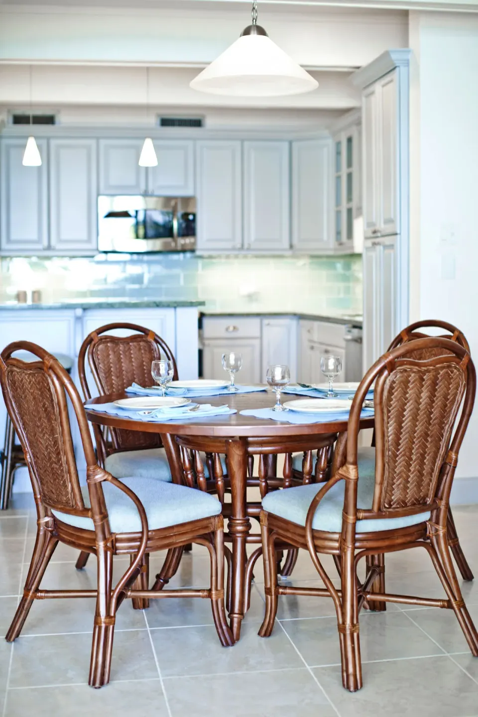 Set dining table and kitchen in a beachfront condo at Secret Harbour Beach Resort.