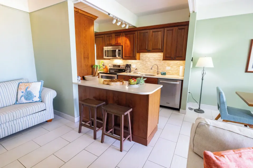 Beachfront condo kitchen with breakfast bar at Secret Harbour Beach Resort.