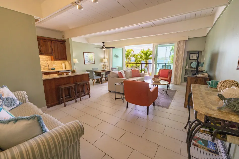Open-plan beachfront condo living and kitchen area at Secret Harbour Beach Resort.