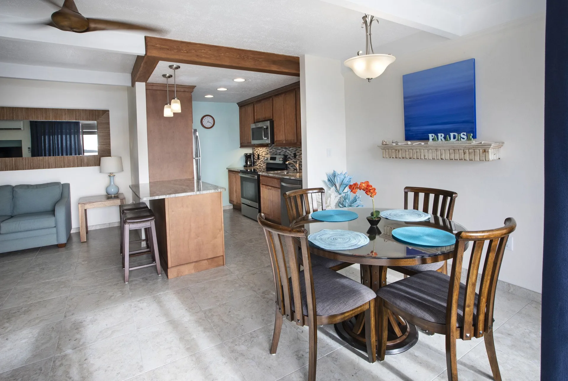Dining area and kitchen in a hillside one bedroom condo at Secret Harbour Beach Resort.