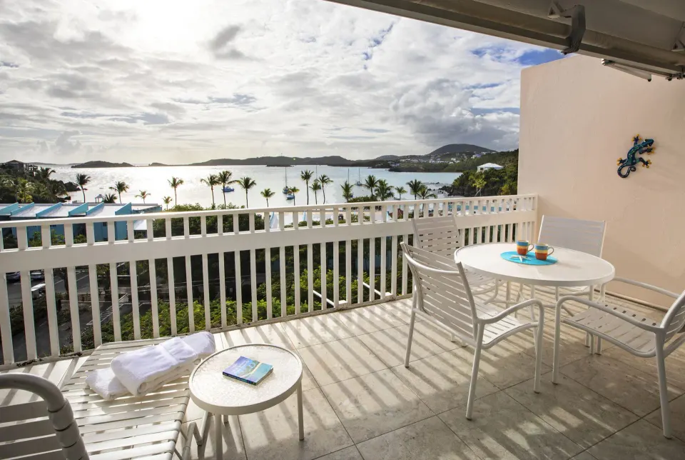 One-bedroom hillside condo balcony with bay view at Secret Harbour Beach Resort.