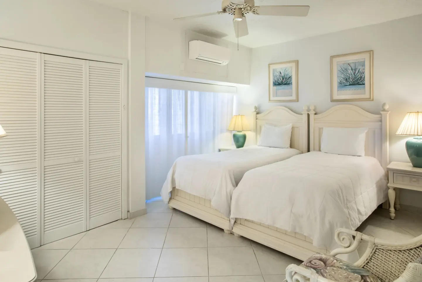 Twin beds in a hillside two-bedroom condo at Secret Harbour Beach Resort.