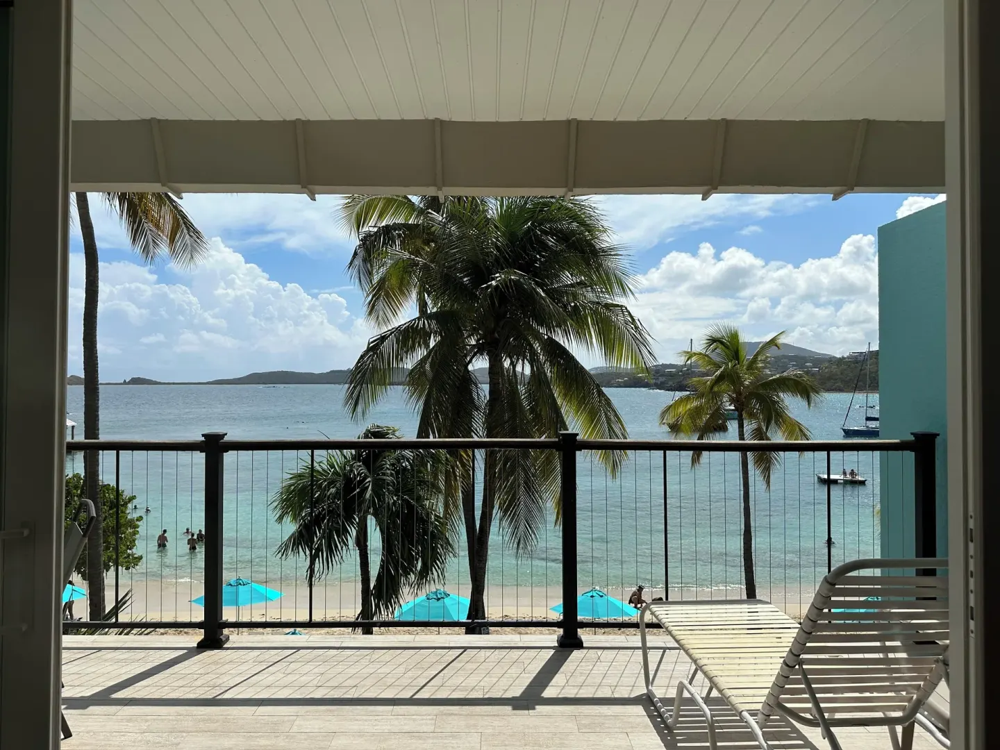 Beachfront Studio Suite balcony view over beach and bay at Secret Harbour Beach Resort.