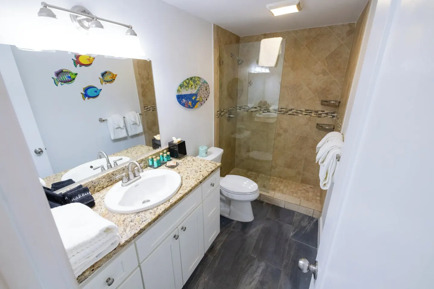 Beachfront Studio Suite bathroom vanity and shower at Secret Harbour Beach Resort.