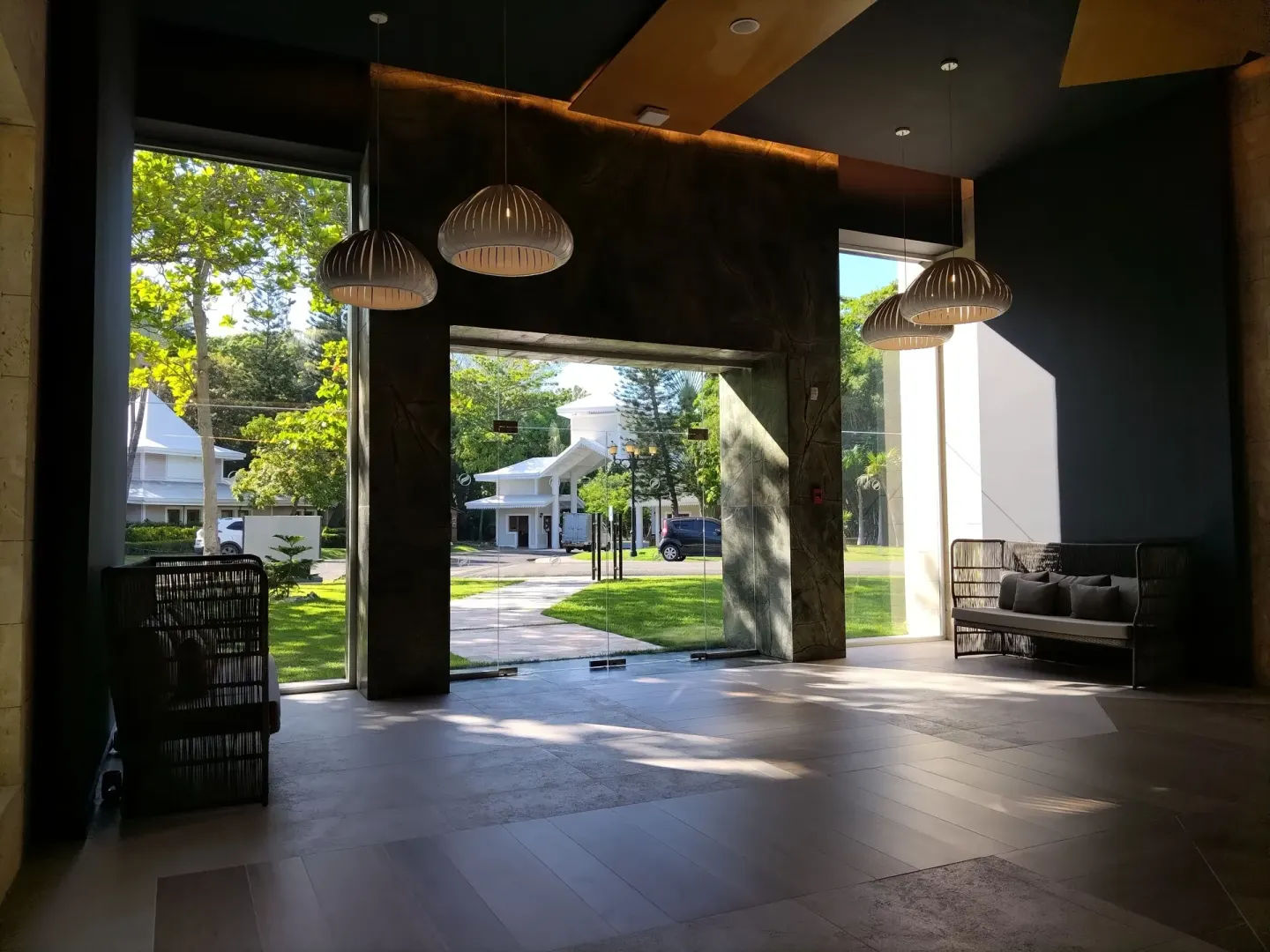 Lobby seating and glass entrance doors at Senator Puerto Plata.
