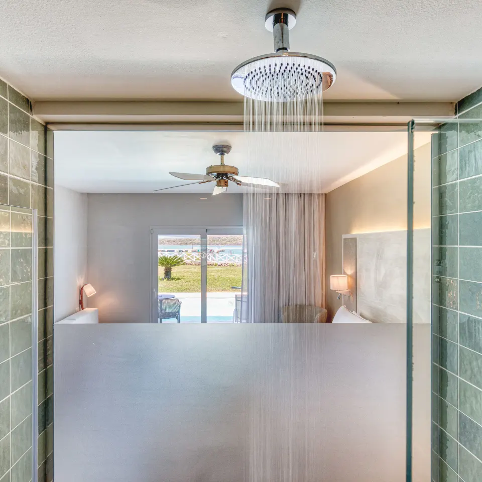 Luxury Junior Suite Ocean View rainfall shower overlooking the bedroom at Senator Puerto Plata.