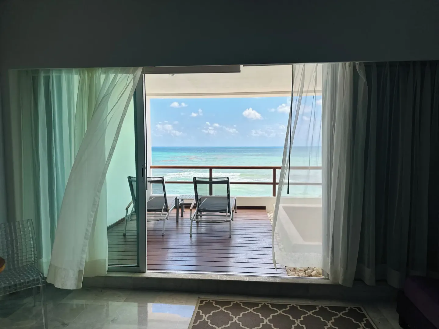 Guest room opens to an oceanfront balcony at Senses Riviera Maya Oceanfront.